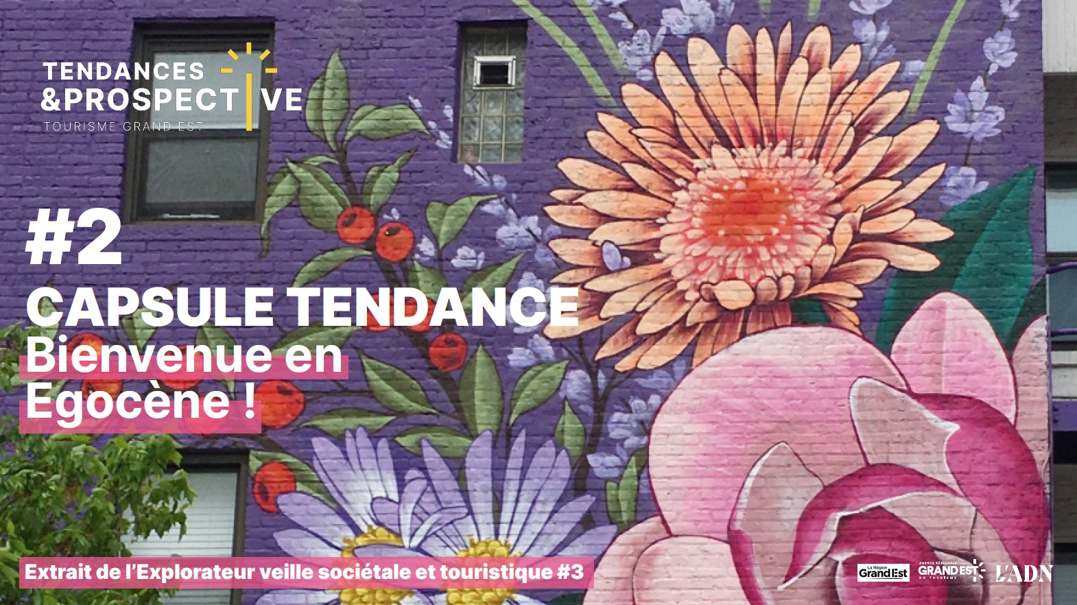 Fresque murale colorée avec fleurs géantes et texte promotionnel